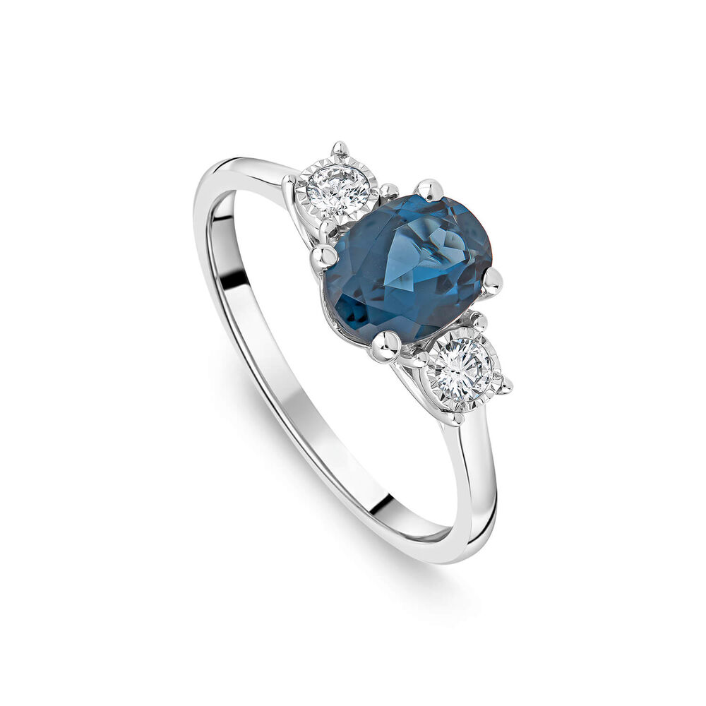 9ct White Gold Oval Blue Topaz & 0.15ct Diamond Sides Ring image number 0